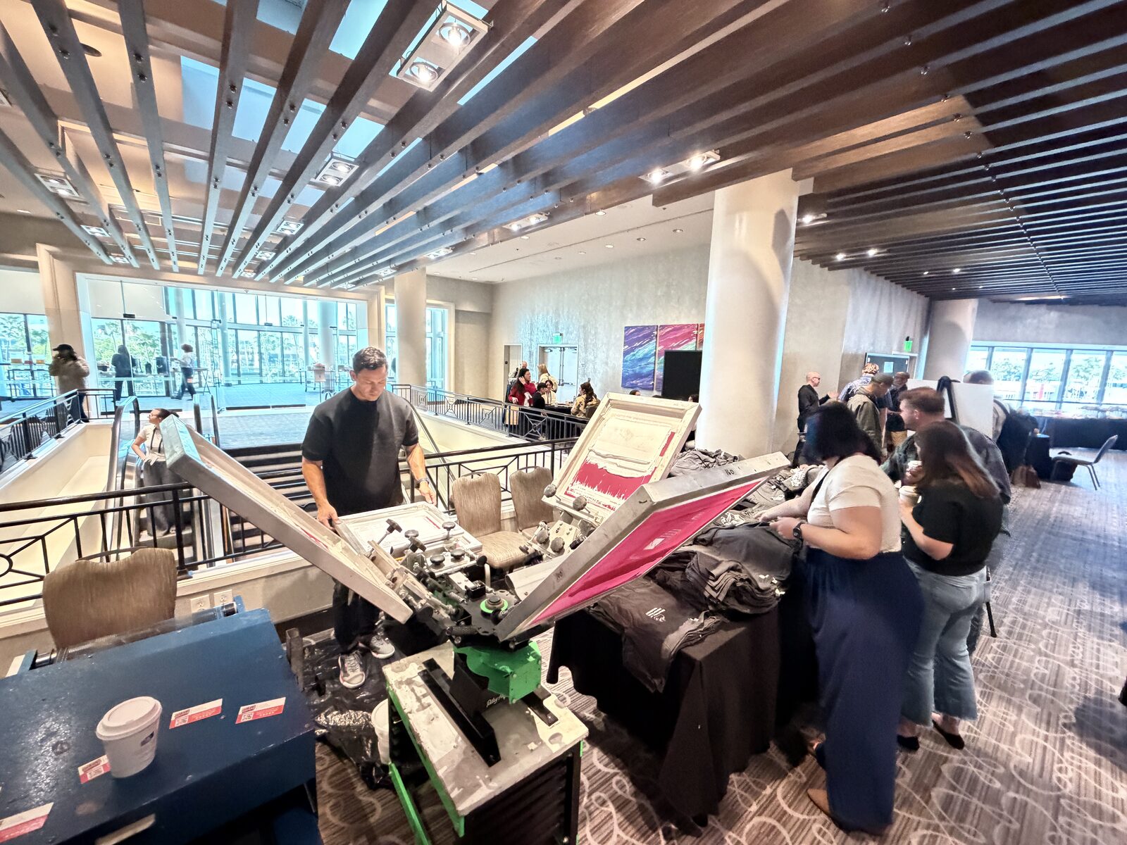 Merch Troop live printing — fresh prints off the platen